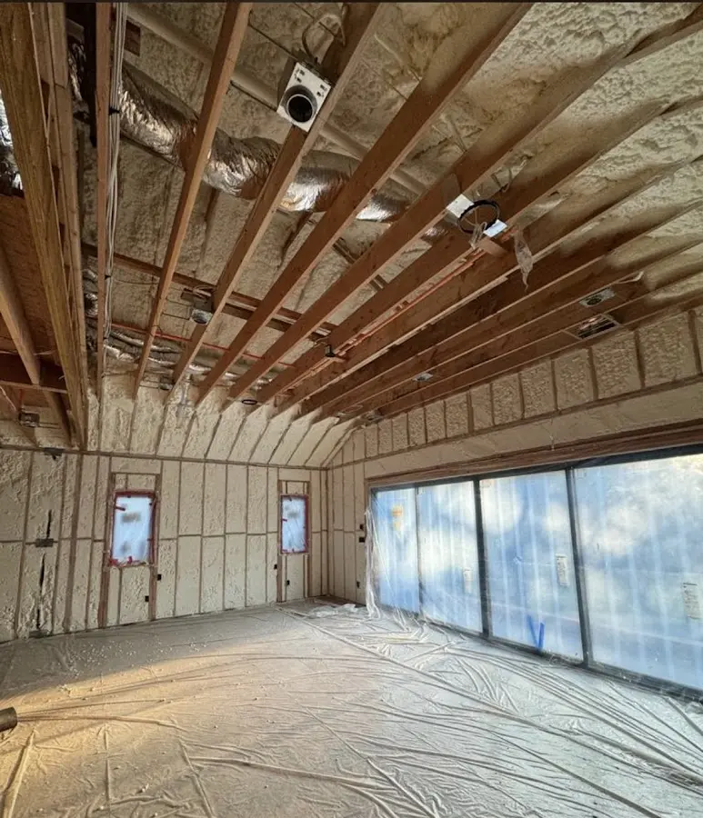 Interior walls and ceiling insulated with spray foam during new construction in Forest